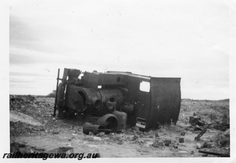 P07962
Haine St. Pierre loco, abandoned and laying on its side at Peak Hill, front and top view, c1965, same as P 04734, 

