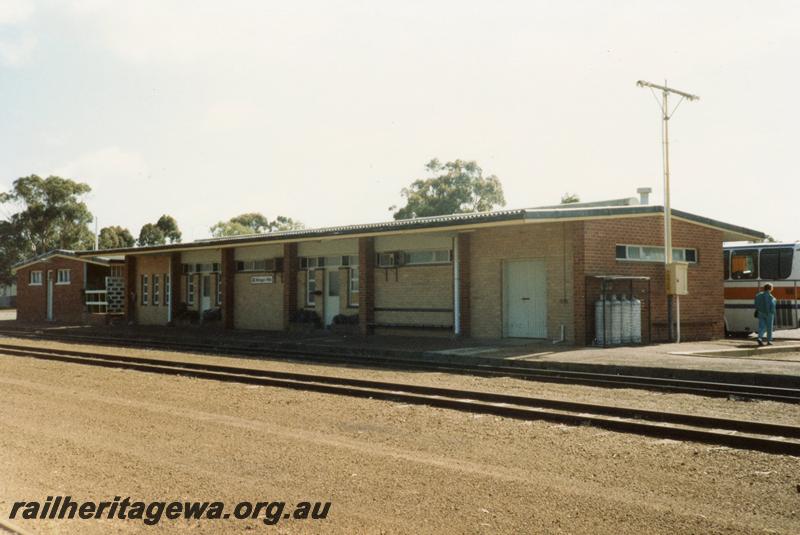 P08465
Wongan Hills, station building, view from rail side, EM line. Part of railway road bus behind building.
