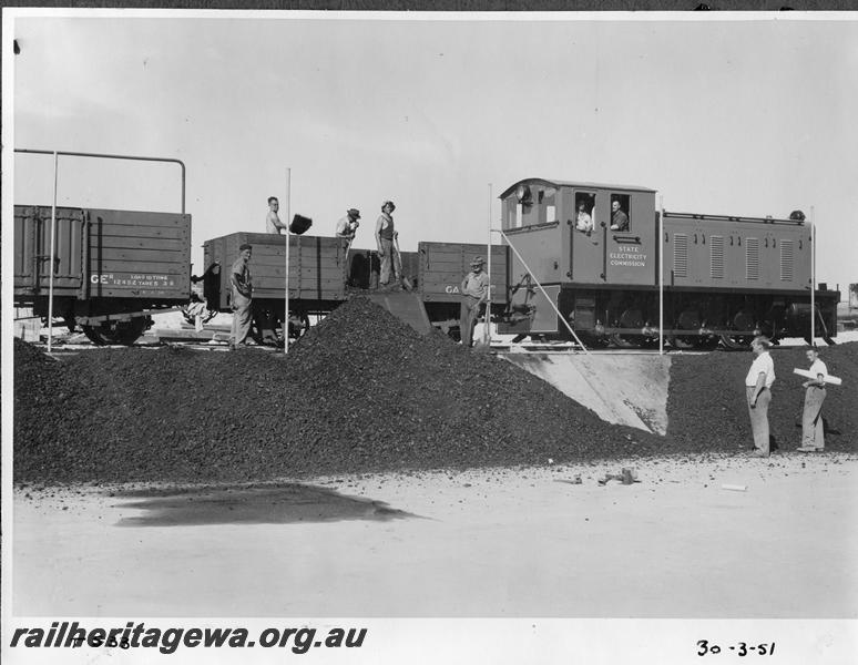 P08687
SEC diesel loco, GA class wagon, GER class 12452 wagon, South Fremantle Power station, unloading coal by hand as the tippler not yet in operation. end and side view of loco.
