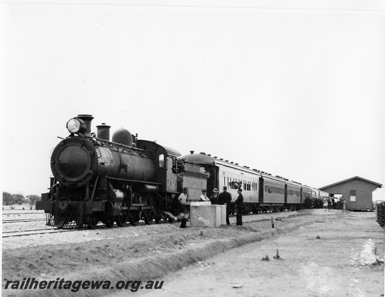 P10289
L class steam loco, country passenger carriages, station building, Big Bell, NR line, view along the train, same as P7664 but larger format and better quality
