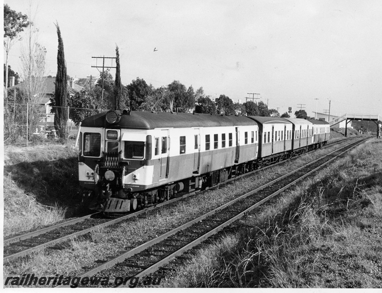 P10375
ADGV class 615 suburban diesel railcar, front and side view, with AYE class carriages in the consist, near Cottesloe.
