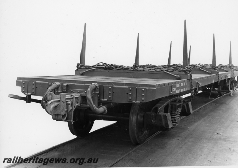 P10936
End and side view of an unidentified QC class flat top bolster equipped wagon at Midland Workshops.
