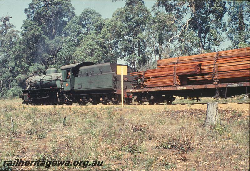 P11821
W class 927, up goods, coupled to a QC class wagon with a timber load departing Pemberton. PP line.

