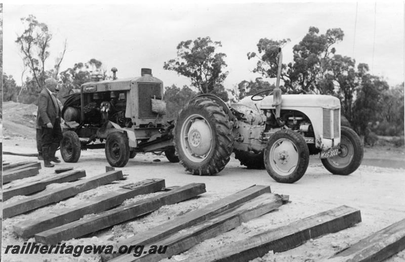 P12031
9 of 12 images of the construction of the Kwinana to Jarrahdale railway. (ref: The Railway Institute Magazine, July 1963).view shows a mobile compressor being hauled by a tractor
