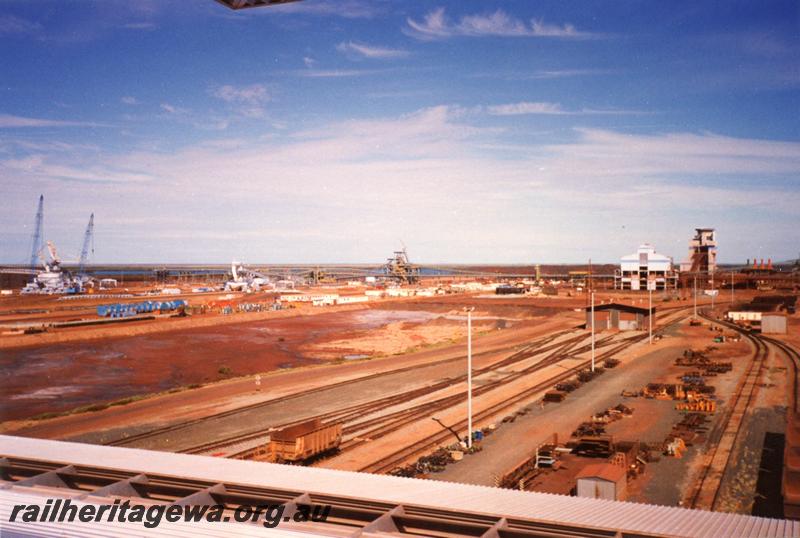 P12548
View from Port Hedland Nelson Point Yard Control Tower looking west, new South Yard stockpile for the new Yandi mine being built at left, wheel lathe building with TCB2 and TSB2 in the background
