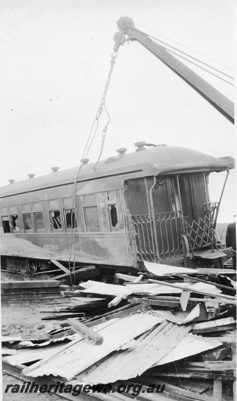 P12812
ARS class second class sleeper carriage, derailed at Korrelocking, GM line, crane lifting the carriage, debris spread around the tracks
