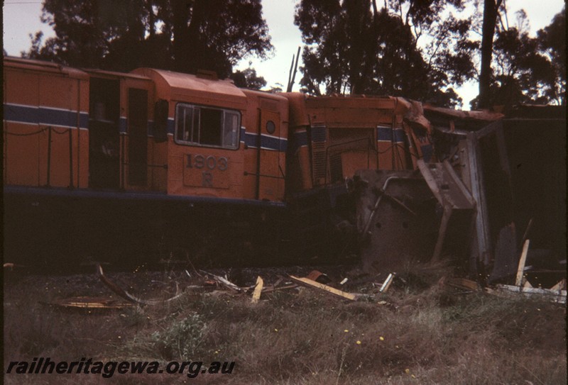 P12890
R class 1903, damaged and derailed due to collision at Beela, BN line, on 6.11.1981, side view of cab and end of the A class long hood.
