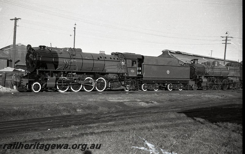 P13047
V class 1204, as new, fully line out including the tender sides and with walled tyres, Midland Junction loco depot, front and side view.
