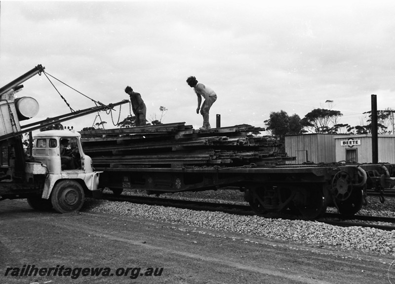 P13555
4 of 4 images of loading/unloading rails at Beete, CE line, tip truck being used as a crane to lift the rails
