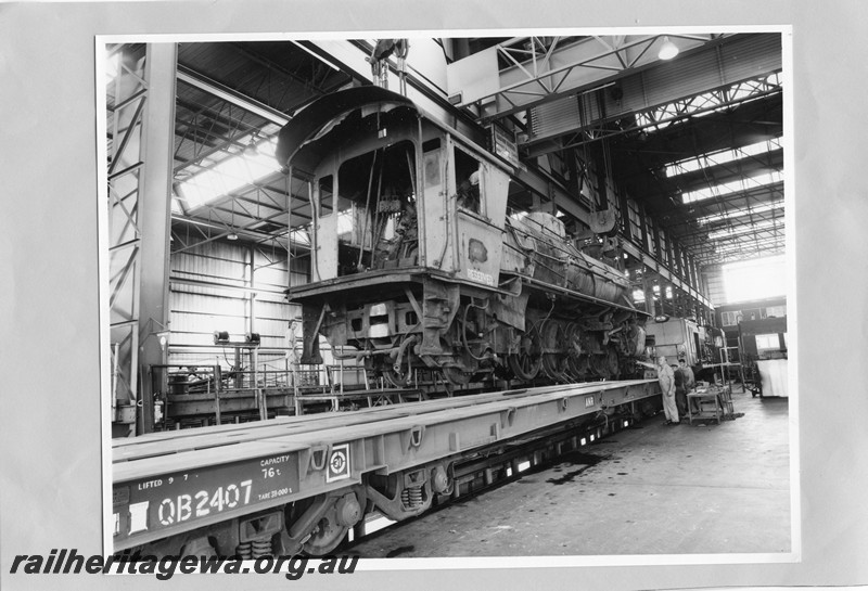 P13606
W class 901 less tender on standard gauge flat wagon being prepared for transportation to South Australia, Midland Workshops
