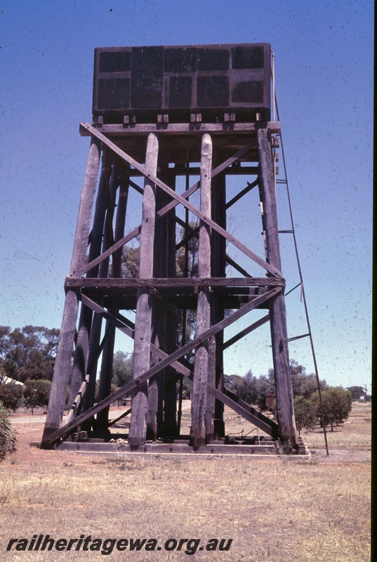 P13823
Water tower with a painted black 25,000 cast iron tank, Cunderdin, preserved, side view
