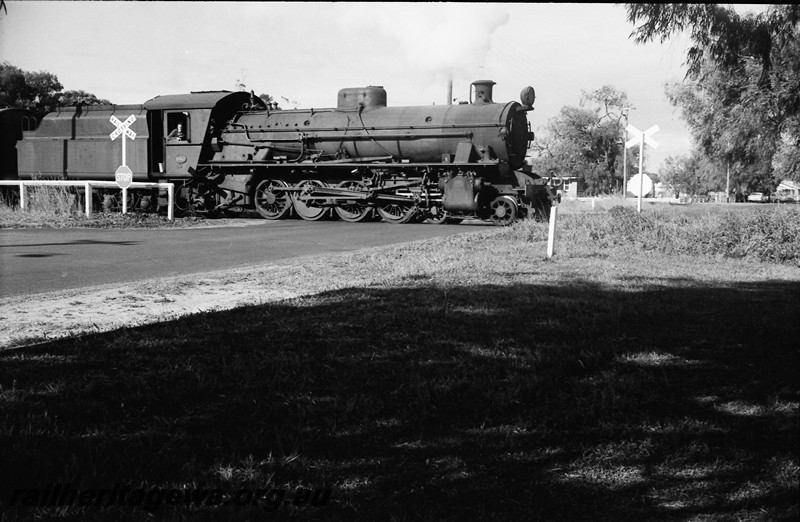 P13954
31 of 32 images of the railway and jetty precincts of Busselton, BB line, W class 942 crossing a level crossing, side and front view.
