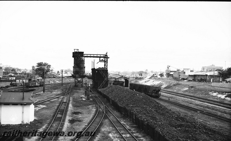 P13978
9 of 17 images of locos, trains and buildings at the East Perth Loco Depot, coaling towers, coal stockpile, view looking south from the Summer street Bridge

