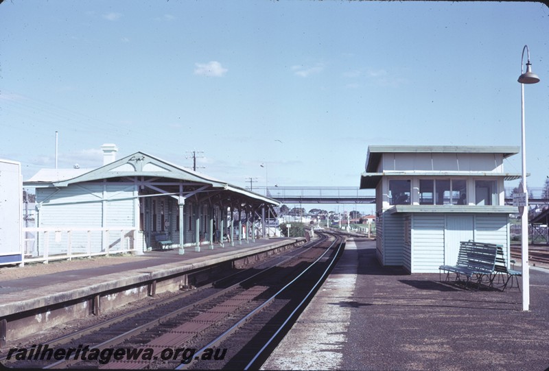 P14405
Station building, signal box, platform lamp, platform seats, Cottesloe, view along the platform looking towards Fremantle
