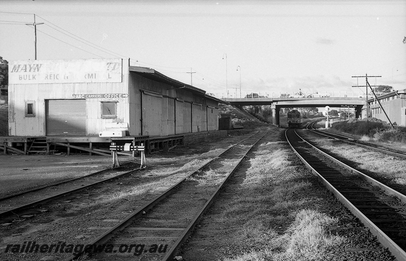P14819
16 of 21 images of the railway precinct and station buildings at Subiaco, c1969, �Mayne Nicklass� bulk freight shed, end and trackside view, railcar passing under the Axon Street over bridge, buffer stop
