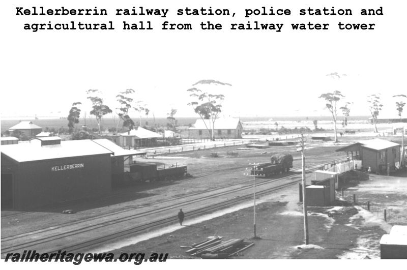P14846
View of Kellerberrin station yard showing goods shed, station building, agricultural hall and police station, view east, c1900, EGR line.

