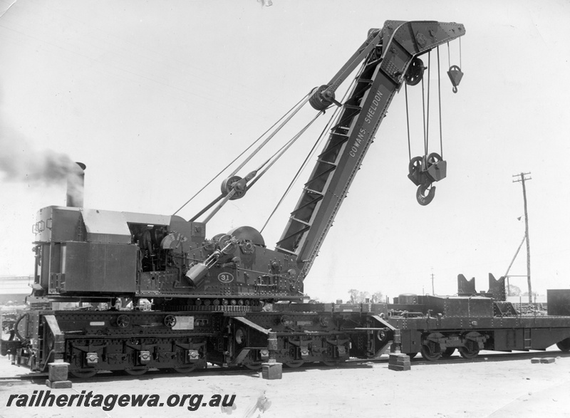 P14984
Cowans Sheldon 60 ton Breakdown Crane No 31 with match truck, in steam, end and side view.
