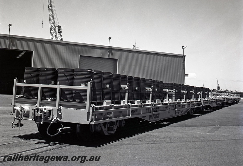P15047
WFP class wagon 30038, laden with drums of nickel matte, North Quay, Fremantle Port, end and side view
