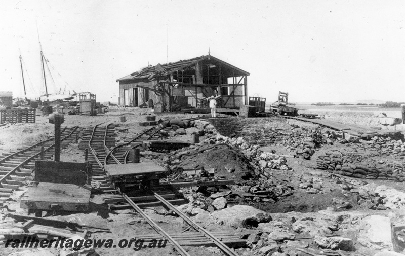 P15111
Cossack Train shed pictured after a destructive 1898 cyclone. Note damage to trackage and buildings. Rollingstock appears untouched. 
