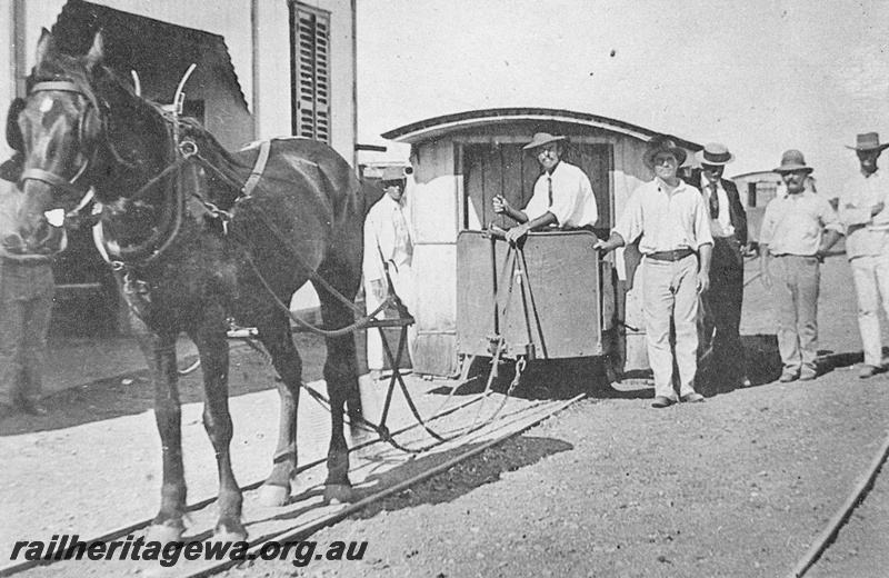 P15116
A horse drawn tram at possibly Roebourne. Note the attire of the bystanders and tram driver.
