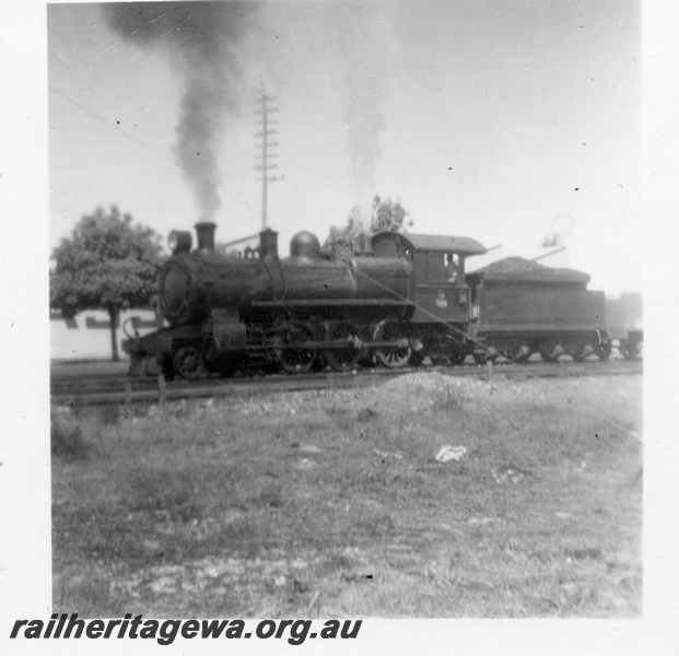 P15144
E class steam locomotive pictured at an Unknown location. Front & side view of locomotive.
