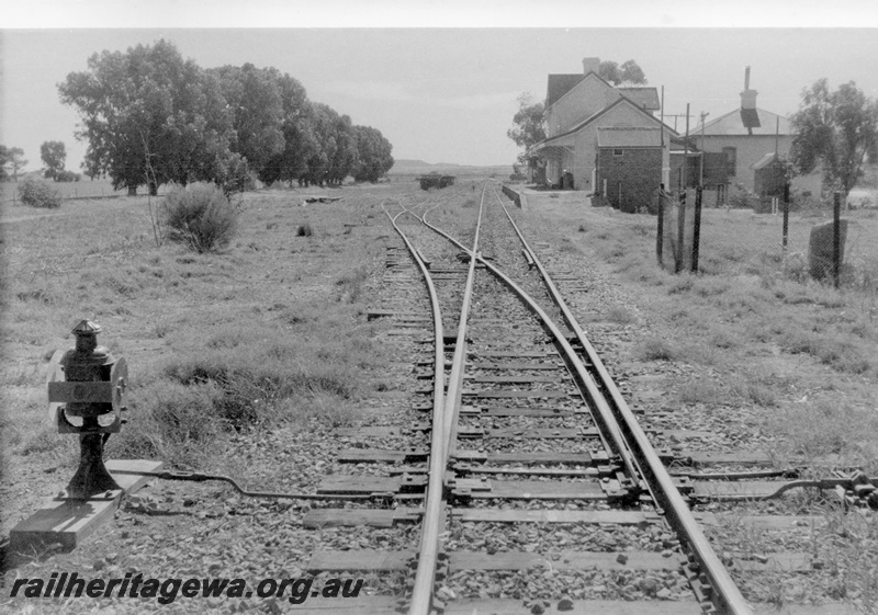 P15181
5 of 8 images of the railway precinct at Walkaway, W line, view looking northwards from the level crossing at the south end of the yard, Point indicator with an oil lamp 
