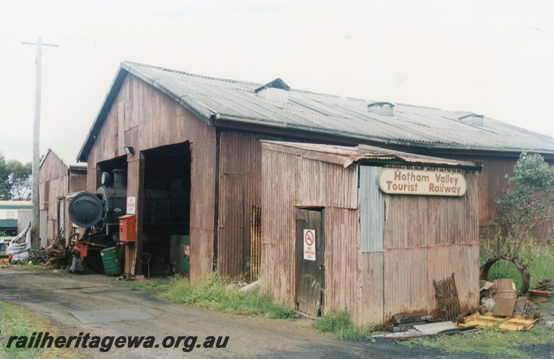 P15188
4 of 6 images of showing the Hotham Valley Railway's use of the facilities at Pinjarra, SWR line, PM class 706 protruding from the loco shed, skillion roofed small shed in the foreground
