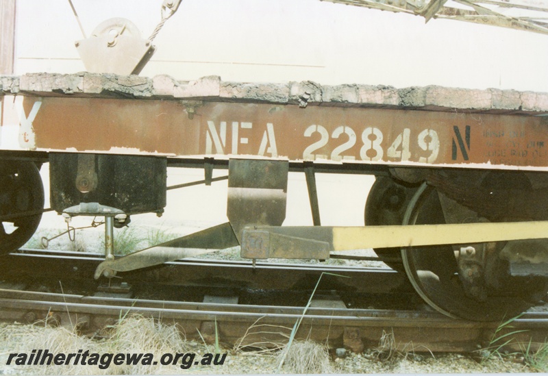 P15798
2 of 5 views of NFA class 22849 four wheel flat wagon being used as a match truck for a steam crane at Midland, brown livery but with a yellow brake lever, view of the lettering, brake equipment
