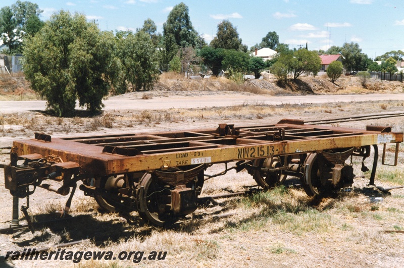 P15808
NW class 21513 four wheel open deck flat wagons for transporting iron ore containers, yellow livery, old Northam Yard, end and side view.

