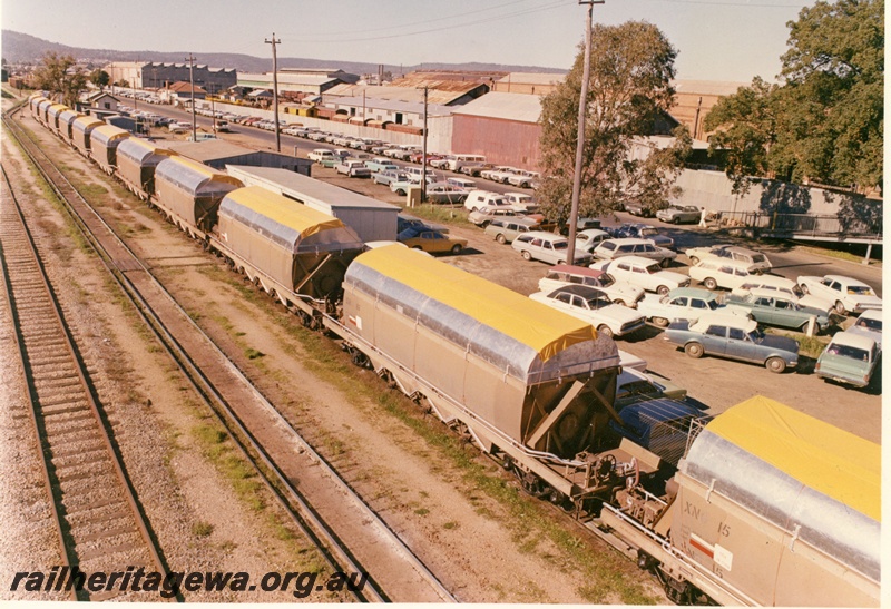 P15872
Rake of several XN Class wagons, ex-XNG Class salt wagons converted for coal traffic, Midland Workshops, ER line, side and front view, from overhead footbridge
