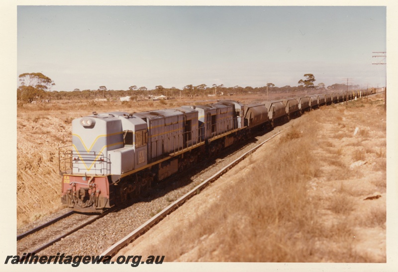 P15874
KA class 212, with another diesel loco, both in light blue with dark blue and yellow stripe livery, double heading a freight train in rural setting, front and side view
