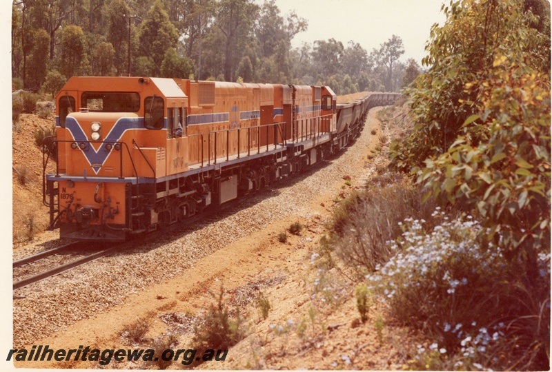 P15901
N class 1876 and another diesel loco, both in Westrail orange with blue and white stripe, double heading bauxite train, rural setting, front and side view

