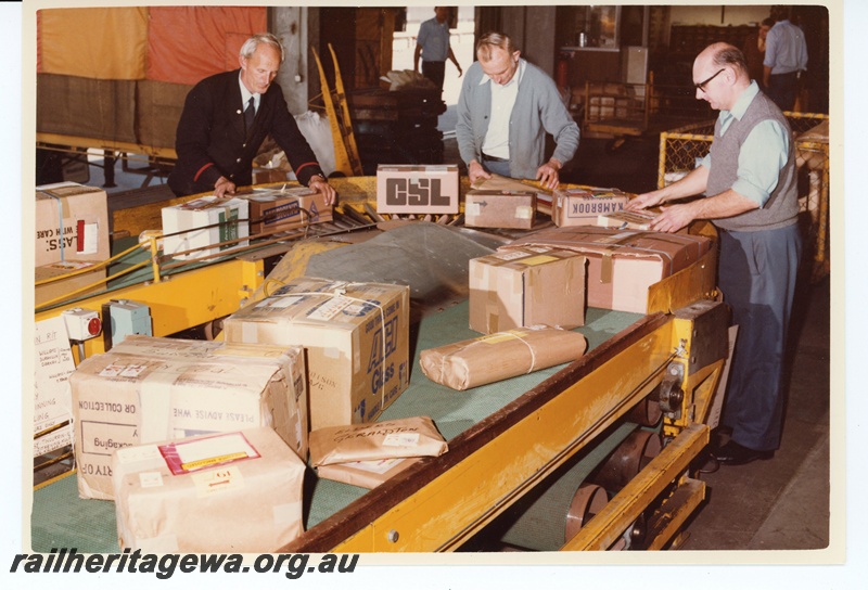 P15951
Parcel handling, conveyor belt, parcel handlers at work, trolleys, Kewdale Freight Terminal, interior view
