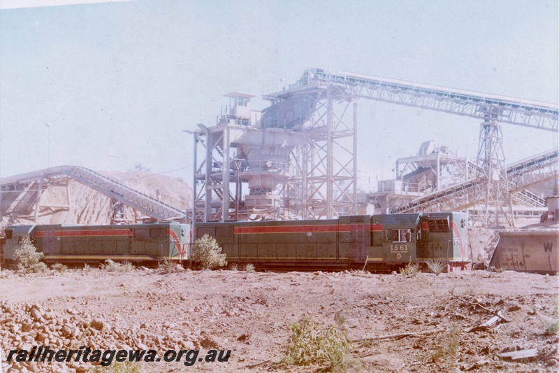 P15971
D class 1561, and another diesel loco, both in green with red and yellow stripe livery, double heading bauxite train including XB class 21014, industrial plant, conveyors, side on view
