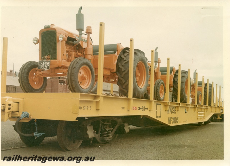 P16021
WF class 30045, flat wagon, yellow, loaded with orange Chamberlain Champion 56 tractors, later reclassified to WFDY and others, end and side view,
