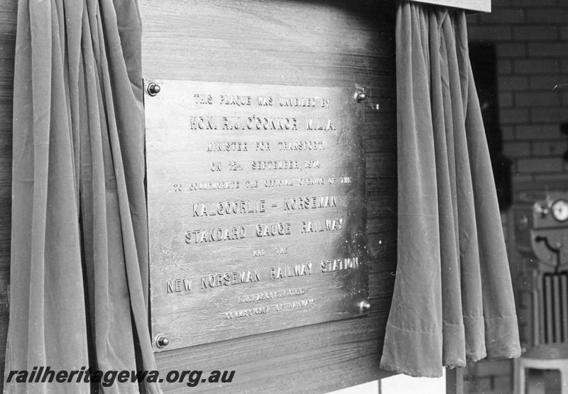P16090
The plaque, after unveiling, commemorating the opening of the new Norseman Station Building as part of the standard gauge line between Kalgoorlie and Esperance.
