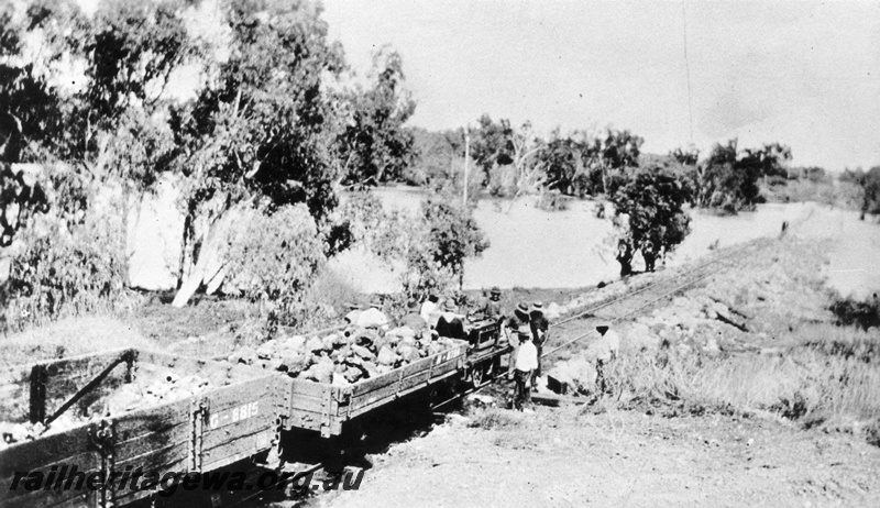 P16105
G class 8815 low sided open wagon with an unidentified H type low sided wagon, gang trolley, repairing the washaway affected line between Port Hedland and Marble Bar. PM line
