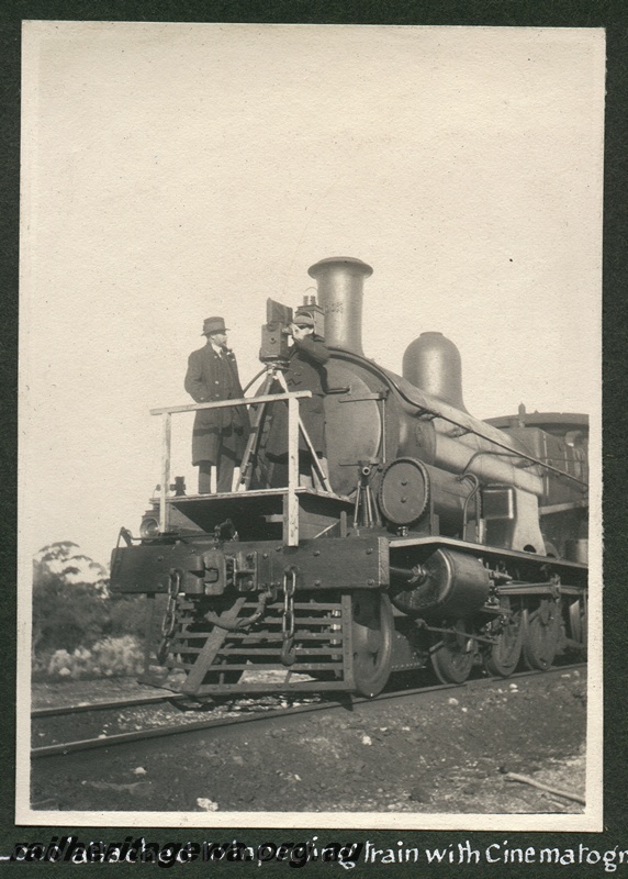 P16184
Commonwealth Railways (CR), G class loco, with platform for camera and cinematographers built onto the front of the loco, on publicity film making train, front and side view
