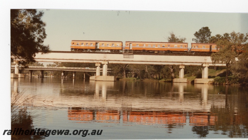 P16337
ADG class railcar set, on concrete and steel bridge, crossing Swan River, Guildford, ER line, side on view
