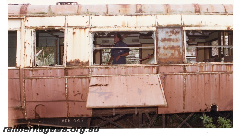 P16494
ADE class 447, in derelict condition, with man inside, side view (part only)
