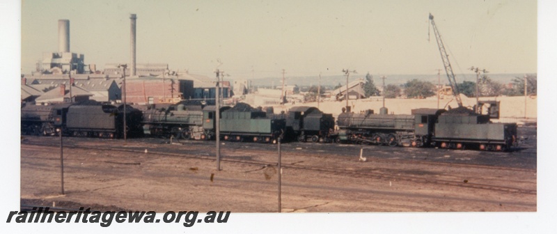P16528
Loco depot, various steam locos in middle distance, crane, powerhouse in background, East Perth 
