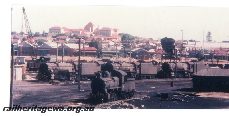 P16529
Loco depot, various steam locos, crane, houses, East Perth 
