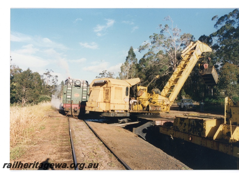 P16575
3 of 4 views of ex WAGR 60 ton Cowans Sheldon breakdown crane No 31, lifting small coal container, adjacent to rear of V class 1213, Pemberton Tramway, rear and side view

