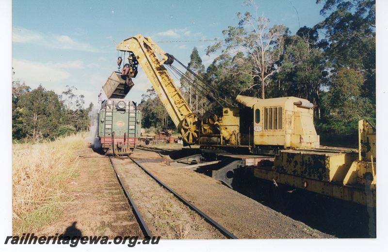 P16576
4 of 4 views of ex WAGR 60 ton Cowans Sheldon breakdown crane No 31, emptying small coal container into tender of V class 1213, Pemberton Tramway, rear and side view
