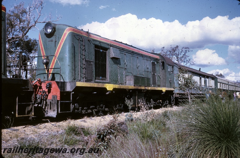 P16661
Ex MRWA F class 41, in green with red and yellow stripe livery, end and side view
