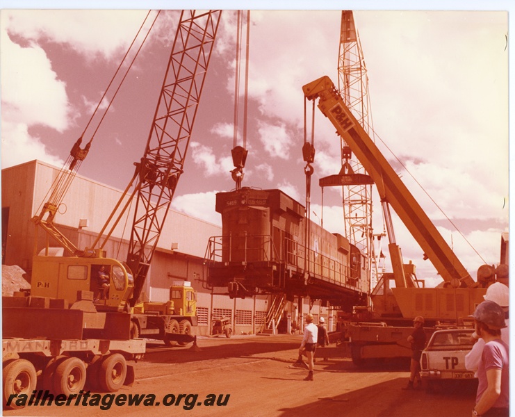 P16742
Mt Newman (MNM) C636 class 5469 being lifted onto low loader at Newman workshops. The loco was being prepared for transport to Comeng for rebuilding
