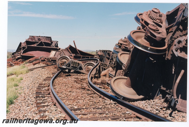P16768
Mt Newman (MNM) loaded ore train derailment 243-246 km. Loss of 88 ore cars 

