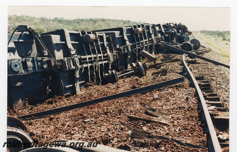 P16769
Mount Newman (MNM) loaded ore train derailment 243-246 km. Loss of 88 ore cars 
