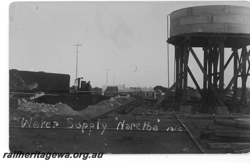 P16795
Commonwealth Railways (CR) - TAR line, water tower with a circular corrugated iron tank, Naretha. 
