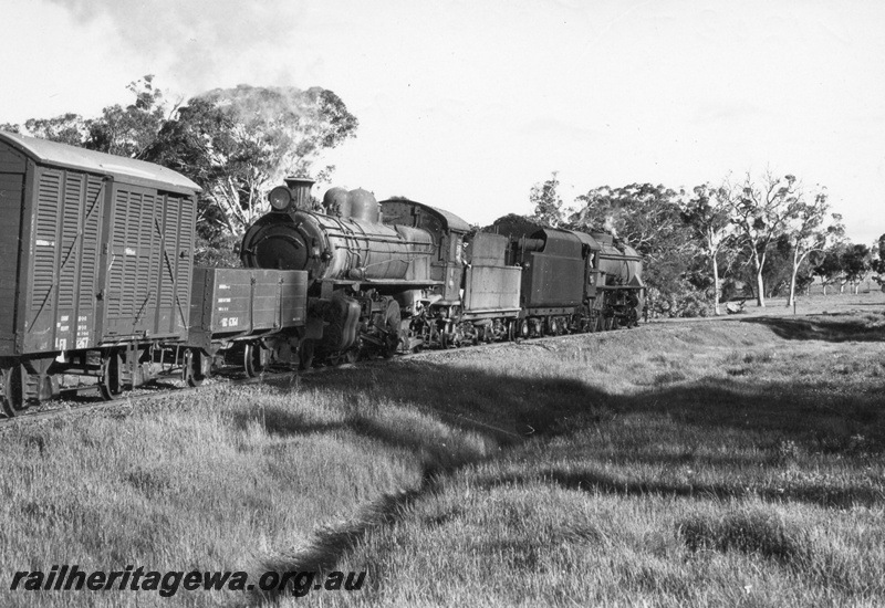 P17031
V class 1203, hauling P508 tender first, at the head of a goods train. First wagon is steel underframed GC class 6464 open wagon, Location Unknown but possibly mid GSR line.
